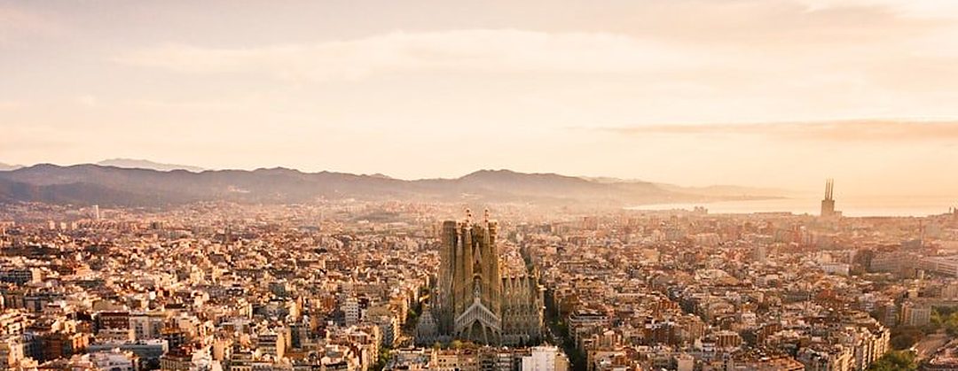 Aerial view of the Eixample in Barcelona with the Sagrada Família in the background